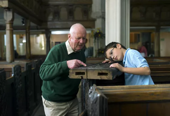 Volunteers worked with the local school children to learn about woodcarving.