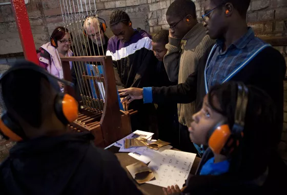 Children learning about the chiming bells