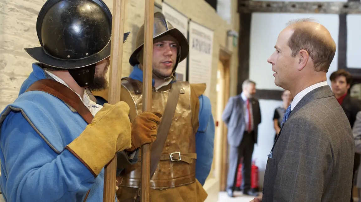 His Royal Highness Prince Edward talks to people in Civil War era outfits