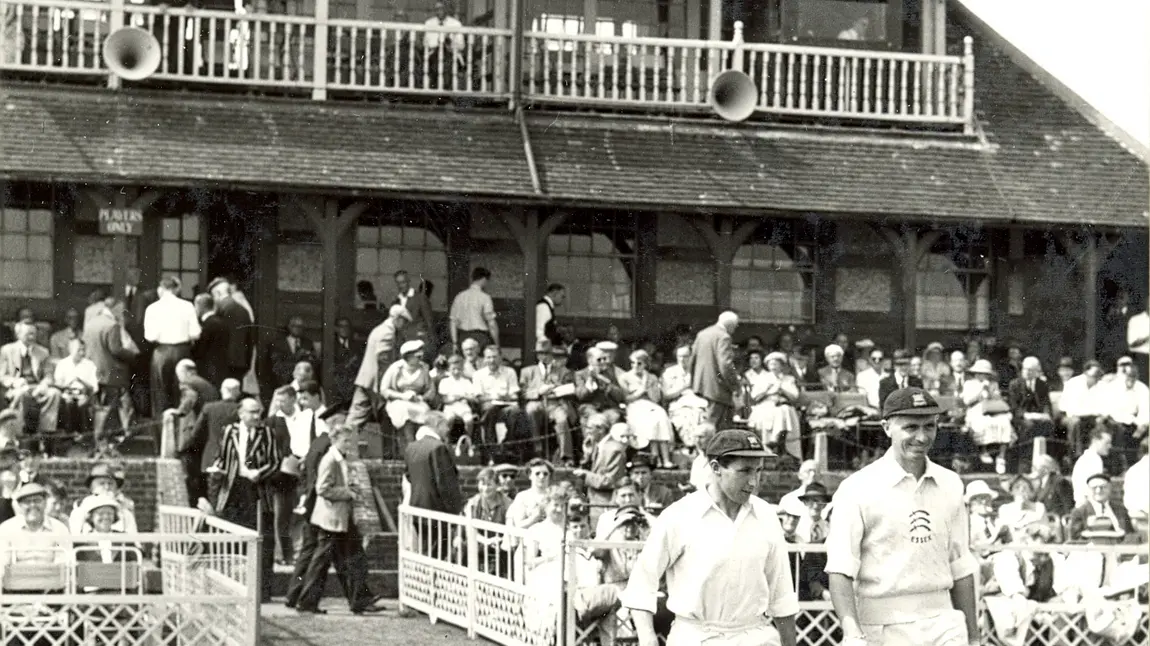 Archive photo of cricketers and crowds in front of the pavilion