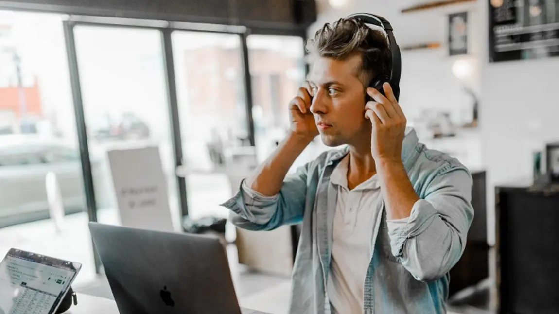 Man with headphones and computer