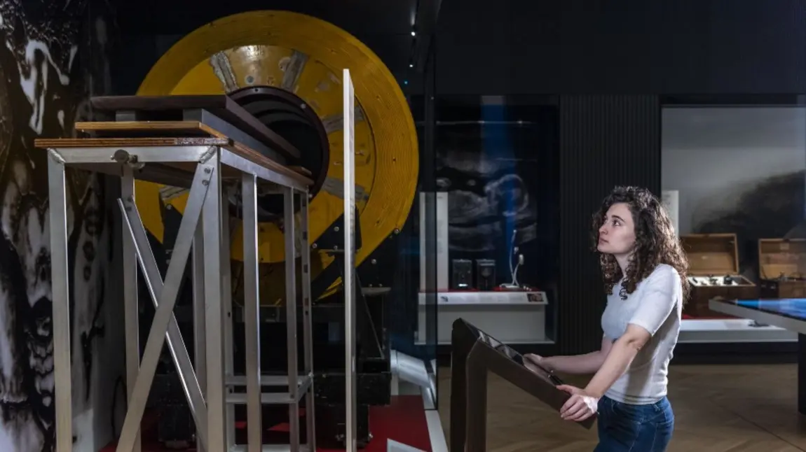 Girl looking at old MRI machine