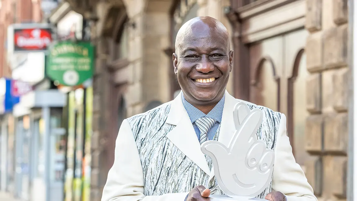 Maxwell Apaladaga Ayamba with lottery trophy