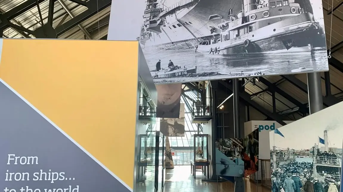 Banners and historic photographs inside the Shipbuilders Gallery.