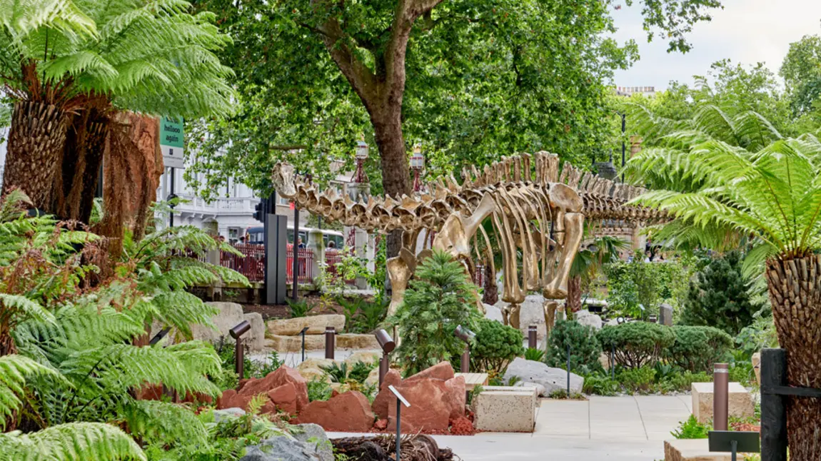 A life-size bronze cast of a dinosaur skeleton in the new gardens surrounding the building