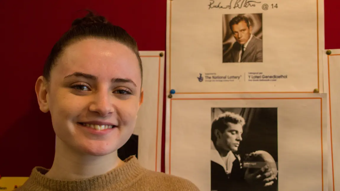 Sophie in front of the students' display