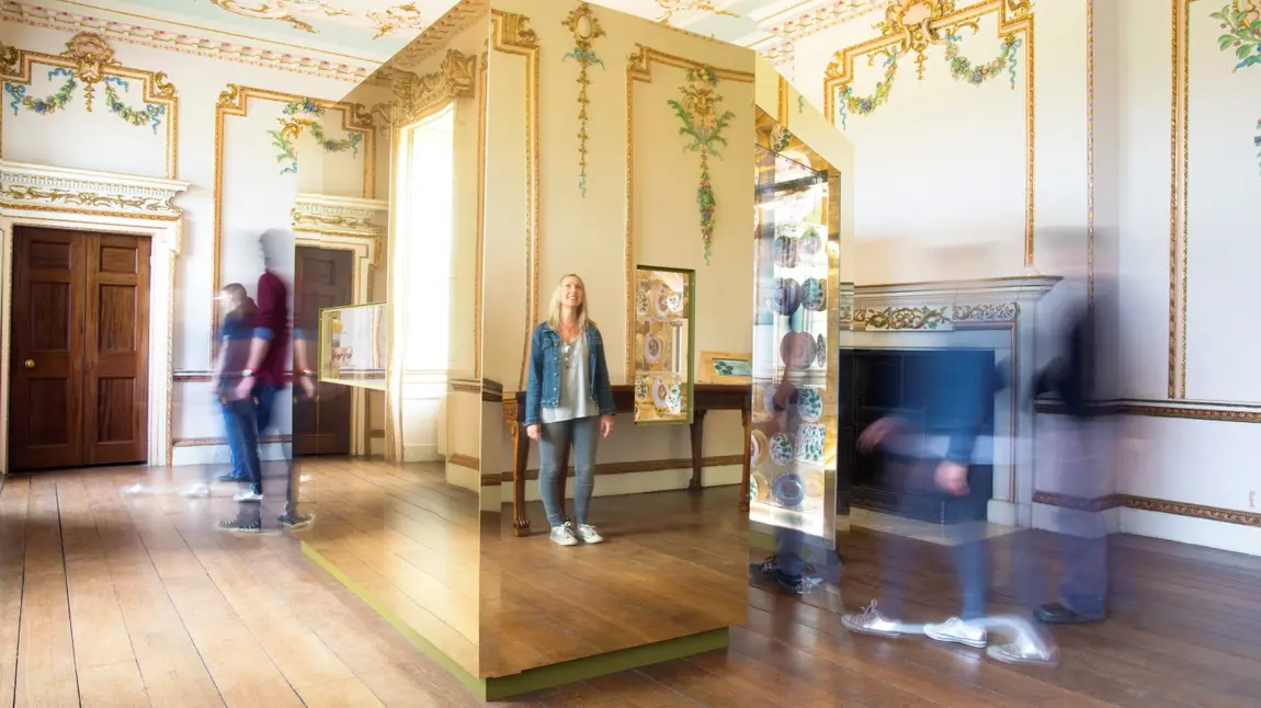 A girl enjoys installation art at Croome house