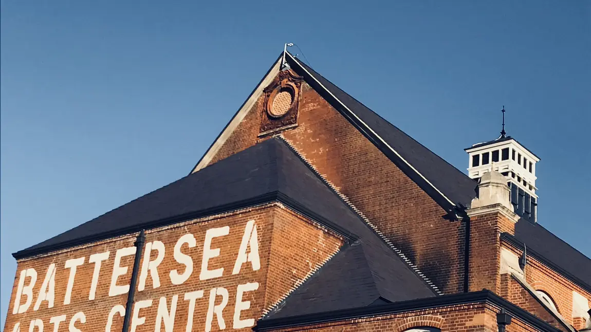 The exterior of Battersea Arts Centre, with it's name painted on the brick in bold capitals