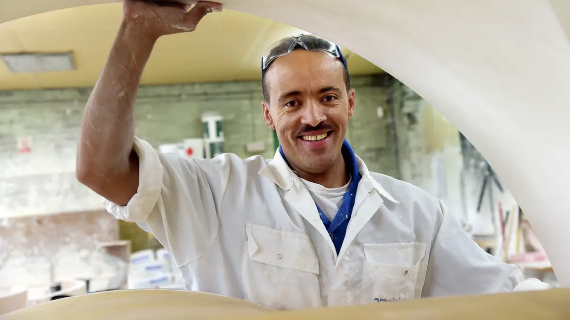 A man holds plaster