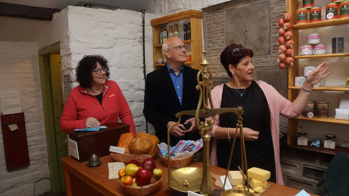 HLF Chief Executive Ros Kerslake chats to volunteers at Mr Ibbit's 1917 shop in Bacup Natural History Museum