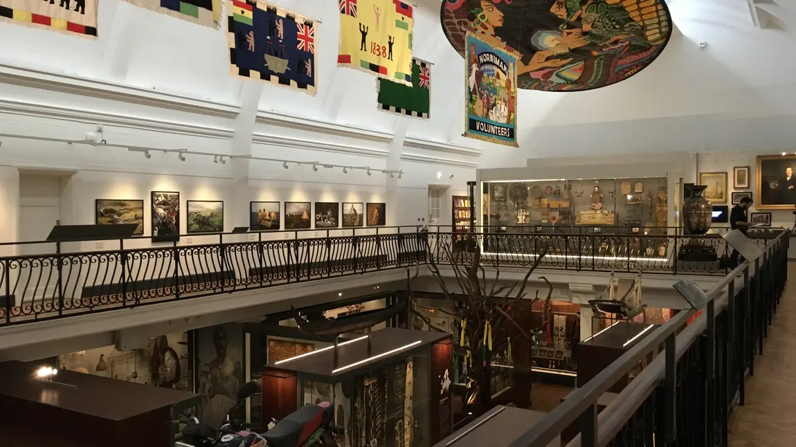 Flags and banners from across the world hang above the World Gallery