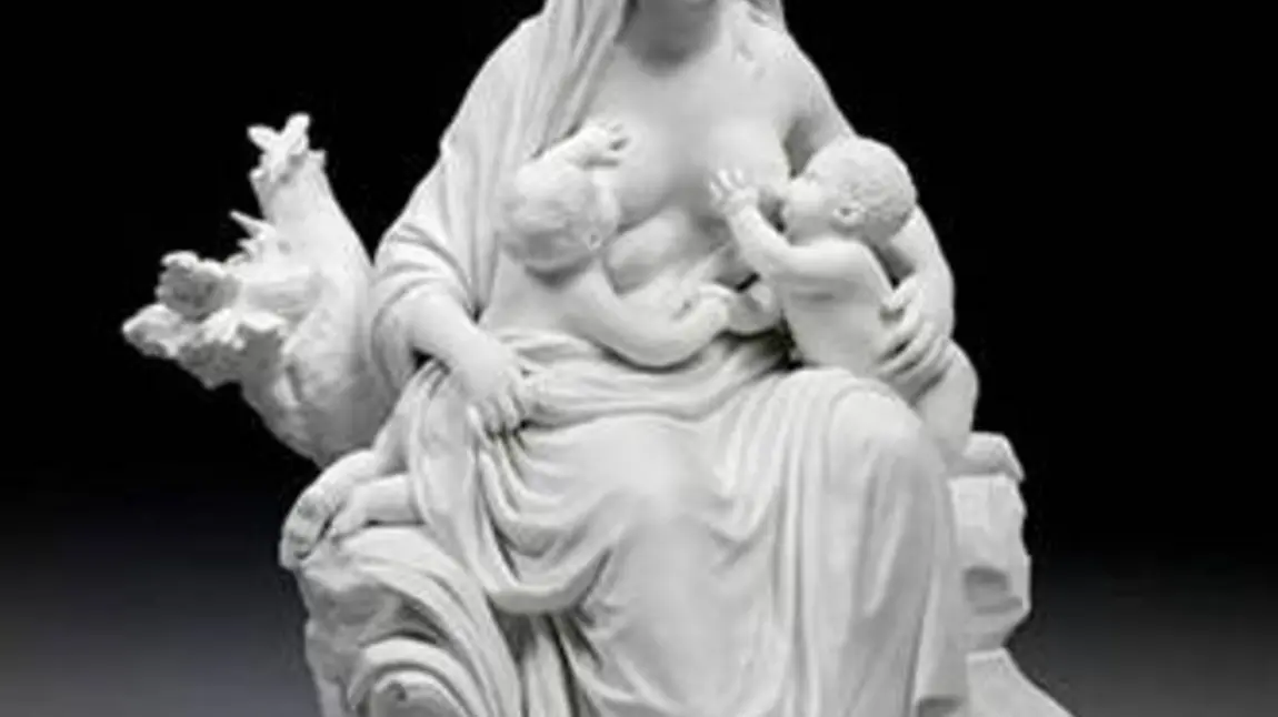 Porcelain figurine showing a maiden nursing to babies