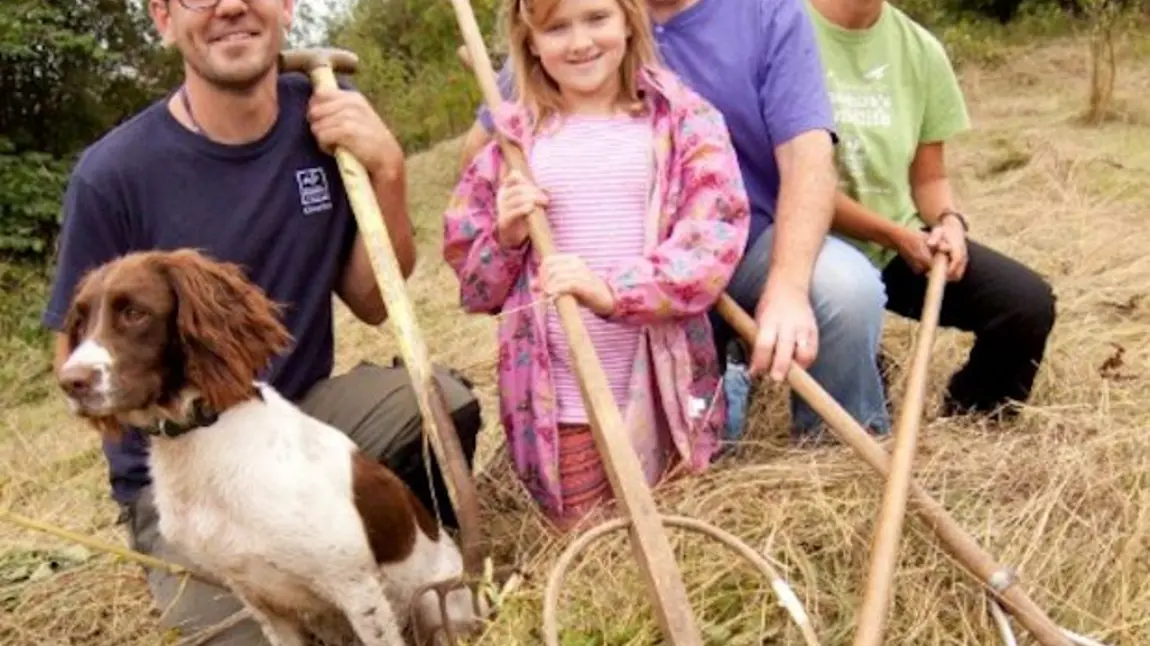 Volunteers at the Natural Futures project with tools used to maintain the natural environment