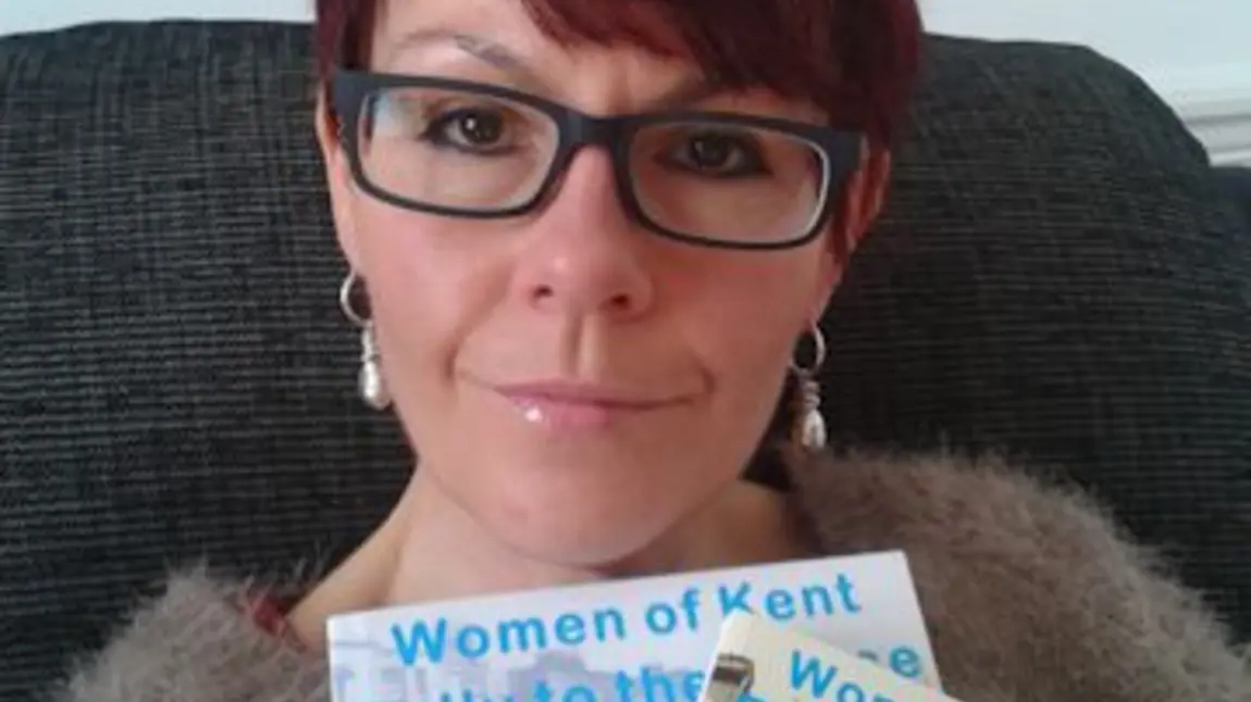 Jo Ursell, Project Manager at Groundwork South Kent & Medway, holding the books that form part of the Sisterhood and Solidarity