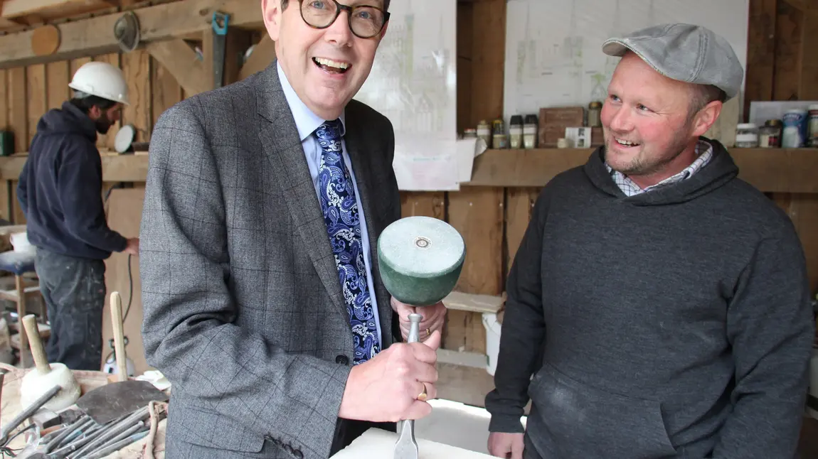 Sir Peter Luff with an apprentice stonemason