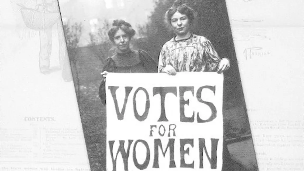 Suffragettes holding up a placard